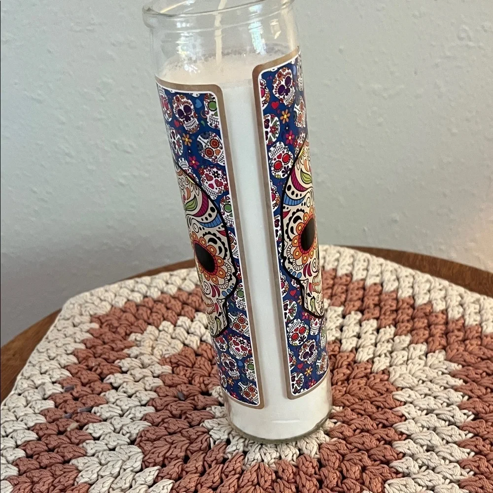 Vibrant Sugar Skull Candle with Blue Floral Design